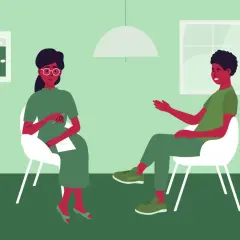 Una persona parla con uno psicologo in un ambiente sereno. La terapia è un passo importante per prendersi cura di sé.